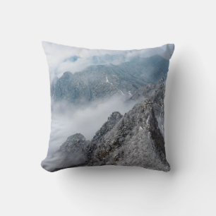 GRAY AND WHITE MOUNTAIN UNDER WHITE CLOUDS DURING CUSHION