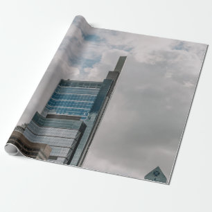GRAY CONCRETE BUILDING UNDER CLOUDY SKY DURING DAY WRAPPING PAPER