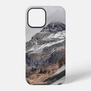 GRAY MOUNTAINS WITH SNOW CAPPED SURROUNDED WITH TR iPhone 12 CASE