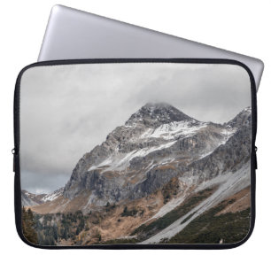 GRAY MOUNTAINS WITH SNOW CAPPED SURROUNDED WITH TR LAPTOP SLEEVE