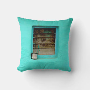GRAY STEEL CONTAINER ON WINDOW WITH TEAL PAINT CUSHION
