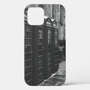 GRAYSCALE PHOTO OF FOUR TELEPHONE BOOTHS LINED UP iPhone 12 CASE