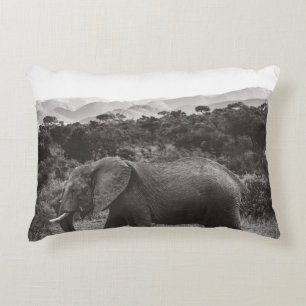 GRAYSCALE PHOTO OF GRAY ELEPHANT NEAR TREES DECORATIVE CUSHION