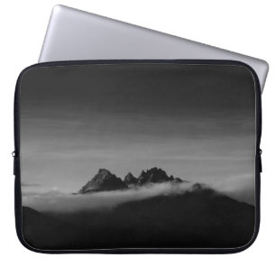 GRAYSCALE PHOTO OF MOUNTAIN COVERED WITH CLOUDS LAPTOP SLEEVE