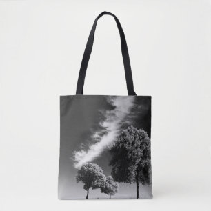 GRAYSCALE PHOTO OF PERSON ON ROAD BETWEEN TREES TOTE BAG