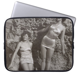 GRAYSCALE PHOTO OF THREE WOMEN STANDING AND SITTIN LAPTOP SLEEVE