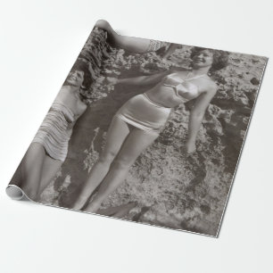 GRAYSCALE PHOTO OF THREE WOMEN STANDING AND SITTIN WRAPPING PAPER