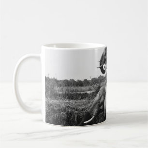 GRAYSCALE PHOTO OF TWO ELEPHANTS ON BODY OF WATER COFFEE MUG