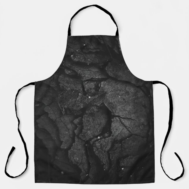 Grayscale photography of rock formation apron (Front)