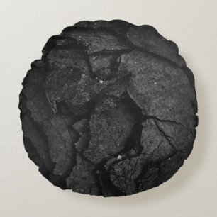 Grayscale photography of rock formation round cushion