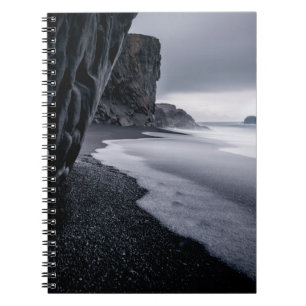 GRAYSCALE PHOTOGRAPHY OF SEASHORE AND CALM SEA NOTEBOOK