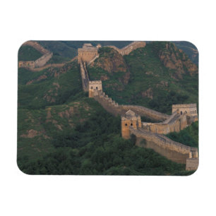 Great Wall winding through mountains. Magnet