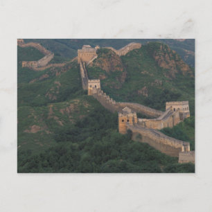 Great Wall winding through mountains. Postcard
