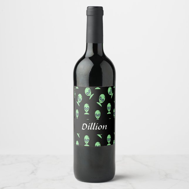 Green alien heads on black wine label (Front)