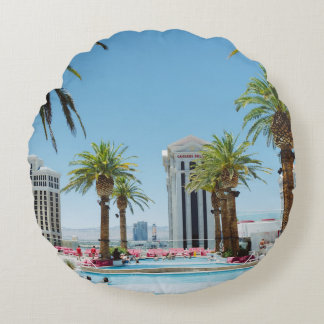 Green and brown palm trees round cushion