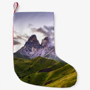GREEN AND GRAY MOUNTAINS UNDER WHITE CLOUDS DURING SMALL CHRISTMAS STOCKING