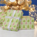 Green and Off White Christmas Trees Pink Christmas Wrapping Paper<br><div class="desc">Introducing our Modern Christmas Wrapping Paper, the perfect choice for adding a touch of contemporary charm to your holiday gifts. This delightful wrapping paper features a vibrant green background adorned with a playful pattern of super cute Christmas trees in shades of green and pink. Among these whimsical trees, you'll find...</div>