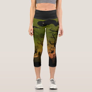 Green and orange haunted graveyard scene Halloween Capri Leggings