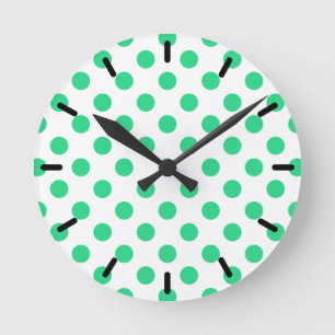 Green and white polka dots round clock