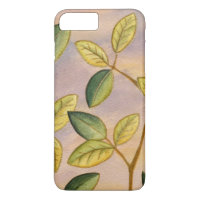 Green and Yellow Leaves on Sunset Background