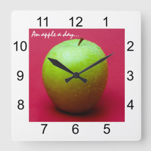 Green apple on red background square wall clock