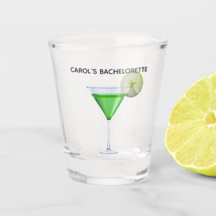 Green appletini cocktail with slice of apple shot glass