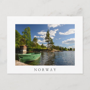 Green boat in a fjord in Norway Postcard