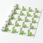 Green Christmas Kids Dinosaur Santa Wrapping Paper<br><div class="desc">Awesome green dinosaur looking very cute in a holiday red Santa hat with a little smile. I like prehistoric Christmas animals and presents that kids will love. Customise this gift with the recipient's name to make it even more personalised.</div>