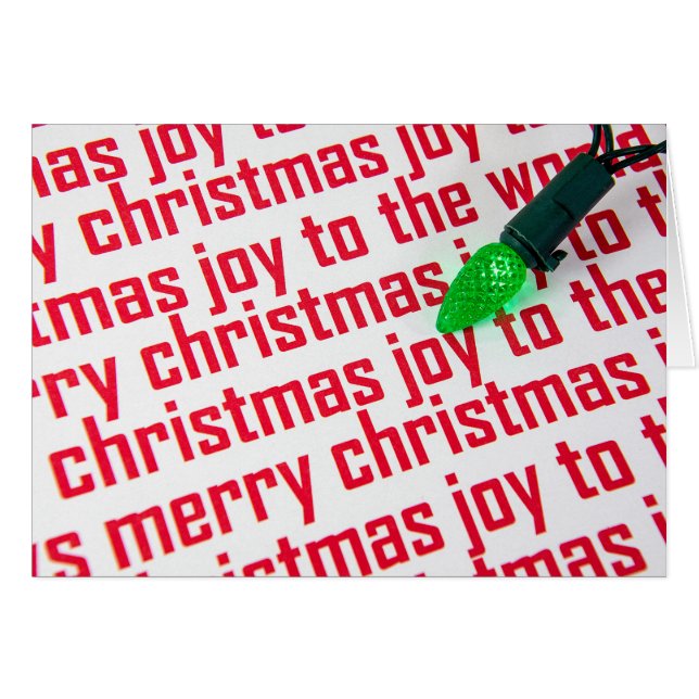 green Christmas light on paper (Front Horizontal)