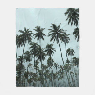 Green coconut trees under white sky in the morning fleece blanket