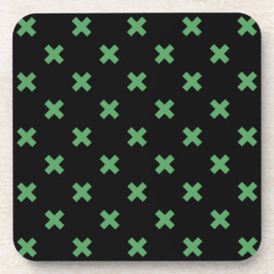 Green cross stitches on black coaster