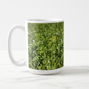 Green field of flowers coffee mug