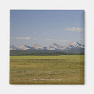 Green Fields And Rolling Hills With Mountains Magnet