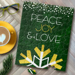 Green Gold Snowflake Peace Joy Love Quote Modern Jigsaw Puzzle<br><div class="desc">“Peace, joy & love.” A giant, fun, playful, gold foil and white snowflake illustration and modern typography on a rich, deep dark green marble watercolor background help you usher in the holiday season. A white and gold confetti dot border frames the top. Feel the warmth and joy of the holiday...</div>