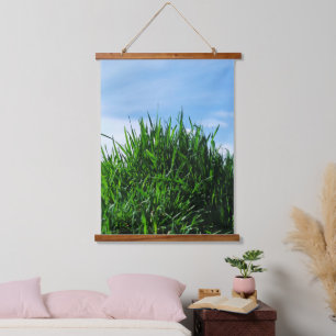 Green grass against the background of the endless hanging tapestry