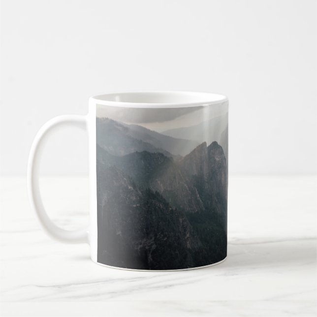 GREEN GRASS FIELD AND MOUNTAINS DURING DAYTIME COFFEE MUG (Left)