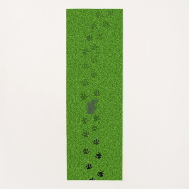 Green grass with dog paw prints and a pee stain yoga mat (Front)