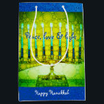Green Hanukkah Menorah Peace Love Light Script Medium Gift Bag<br><div class="desc">“Peace, love & light.” A close-up photo illustration of a bright, colourful, green and yellow artsy menorah against a blue faux glitter background helps you usher in the holiday of Hanukkah in style. Feel the warmth and joy of the holiday season whenever you use this cute and fun custom medium...</div>