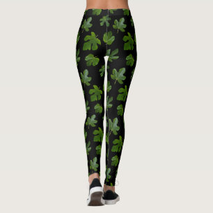 Green leaf closeup isolated on black background leggings
