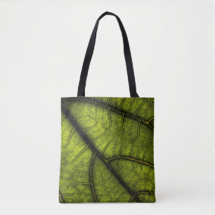Green leaf in close up photography tote bag