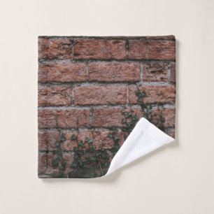 Green-leafed plants near brick wall wash cloth