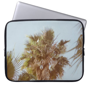 Green-leafed tree in the morning laptop sleeve