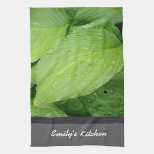 green leafy plant with rain drops tea towel
