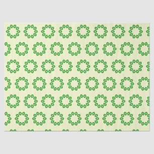 Green leaves in a circle on yellow tissue paper