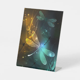 Green luminous dragonfly flight pedestal sign