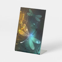 Green luminous dragonfly flight