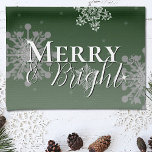Green Merry and Bright Snowflakes Christmas Tea Towel<br><div class="desc">Add a charming touch to your kitchen this holiday season with a Green Merry and Bright Snowflakes Christmas Holiday Kitchen Towel. Kitchen towel design features falling snowflakes with the greeting Merry and Bright in a modern font and a soft white overlay. Additional gift and holiday items available with this design...</div>