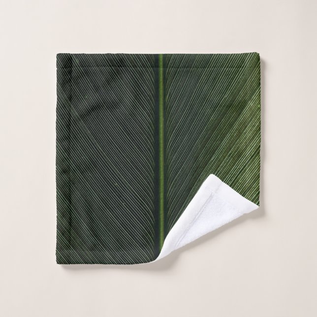Green metal rod on black and white pinstripe texti wash cloth (Wash Cloth)