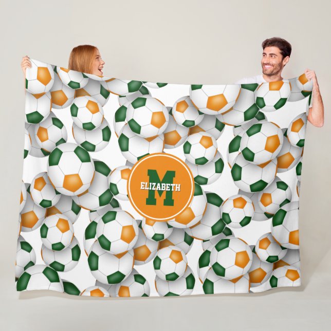 green orange team colours soccer balls pattern fleece blanket (In Situ)