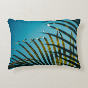 Green palm plant under blue sky in the morning decorative cushion